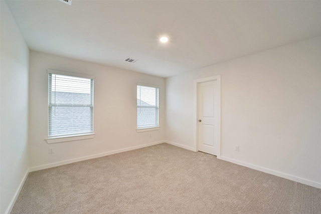 1642 Portia Ln, Conroe, TX 77301 - unfurnished room with baseboards, light colored carpet, and visible vents