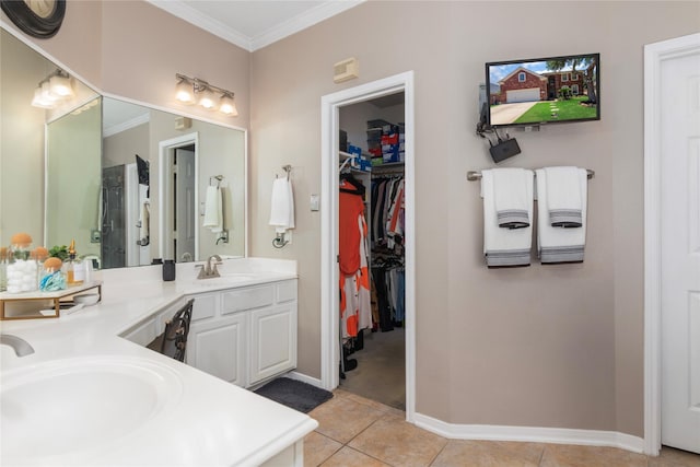 full bathroom featuring double vanity, tile patterned flooring, ornamental molding, and a sink