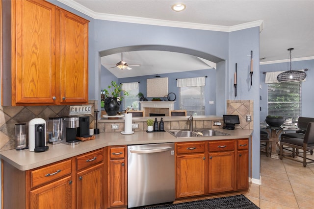 kitchen with a sink, ceiling fan, backsplash, and dishwasher