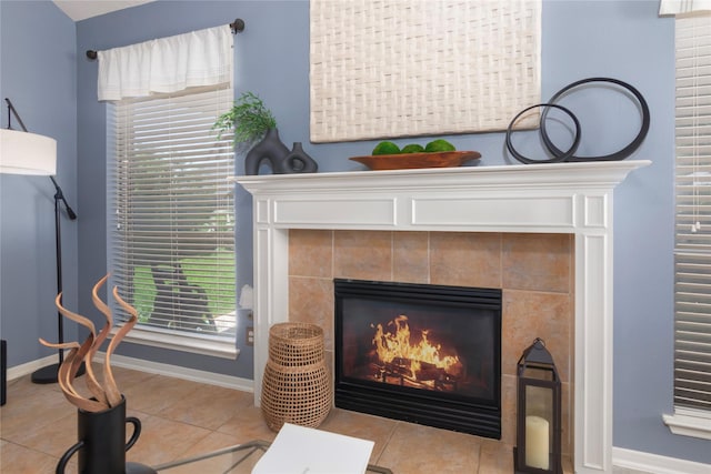 interior details featuring a fireplace and baseboards