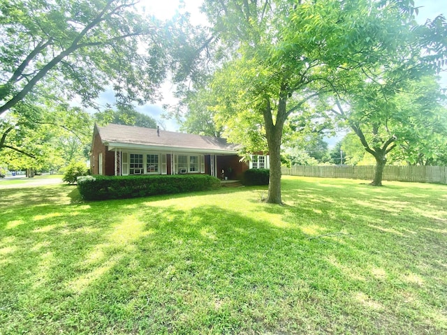 view of yard with fence
