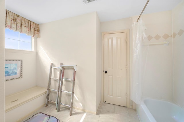 full bath with tile patterned floors, baseboards, and shower / bath combination with curtain