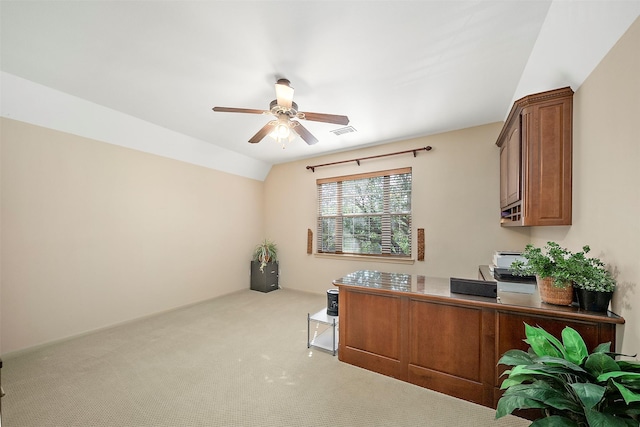 carpeted office space with visible vents, ceiling fan, and lofted ceiling