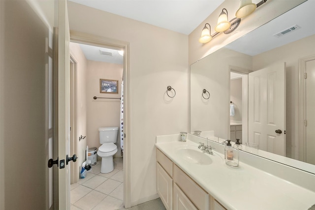 bathroom with visible vents, tile patterned flooring, toilet, and vanity