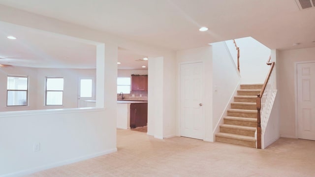 2702 Urban Glen Ct, Houston, TX 77038 - stairs with carpet floors, recessed lighting, baseboards, and a ceiling fan