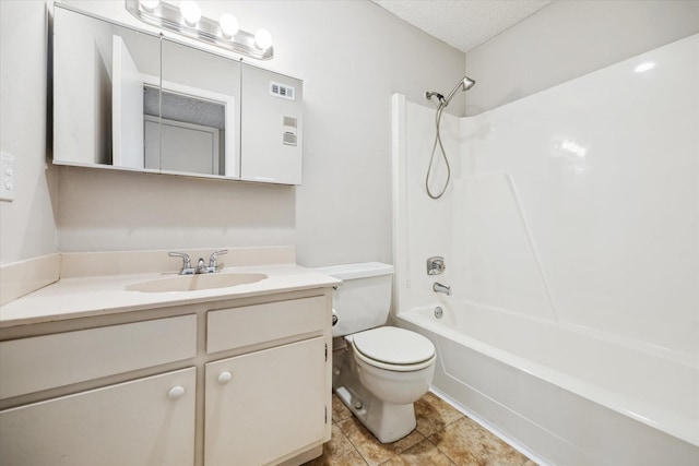 bathroom featuring tile patterned flooring, bathtub / shower combination, vanity, toilet, and a textured ceiling