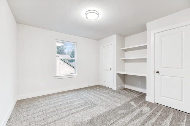111 Sharon Ln, Livingston, TX 77351 - unfurnished bedroom with carpet floors and baseboards