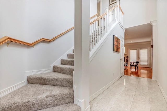 1202 Joe Annie St, Houston, TX 77019 - staircase featuring baseboards and a towering ceiling