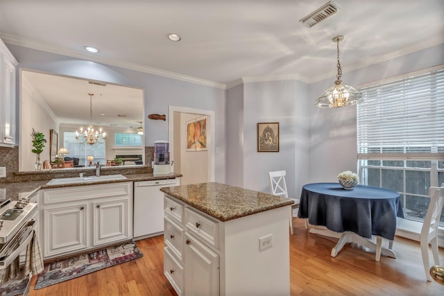 1202 Joe Annie St, Houston, TX 77019 - kitchen featuring stainless steel range with electric cooktop, a sink, dishwasher, a chandelier, and visible vents