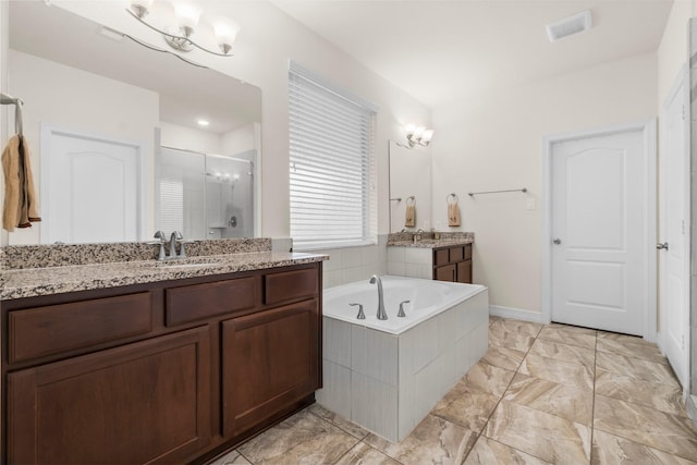 full bathroom with a sink, a stall shower, a garden tub, and two vanities