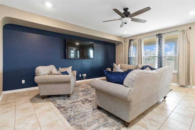 living area with recessed lighting, a ceiling fan, and light tile patterned floors