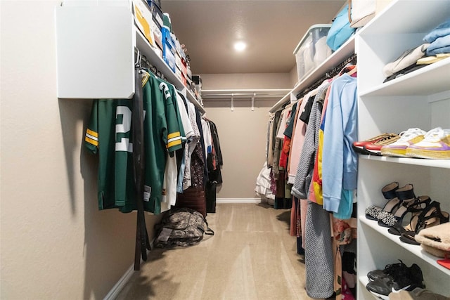 spacious closet with carpet flooring