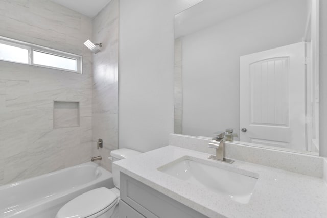 bathroom featuring vanity, toilet, and bathtub / shower combination