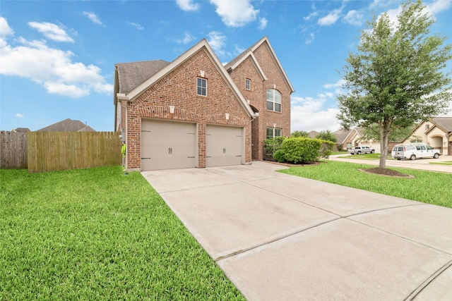 view of front of home with fence, brick siding, a garage, a front yard, and concrete driveway