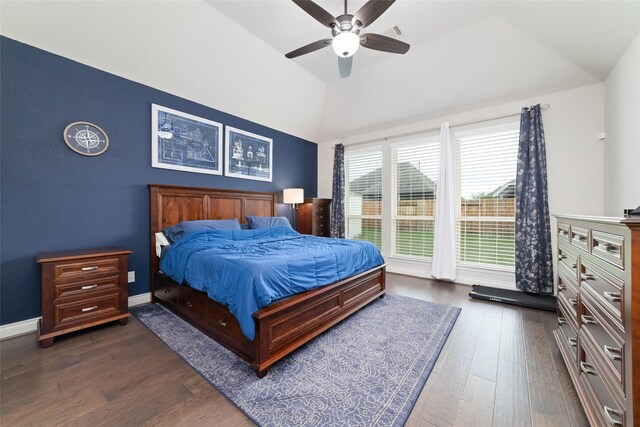 bedroom with a ceiling fan, vaulted ceiling, dark wood-style flooring, and visible vents