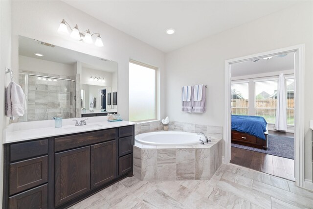 full bath featuring a bath, visible vents, a stall shower, vanity, and marble finish floor
