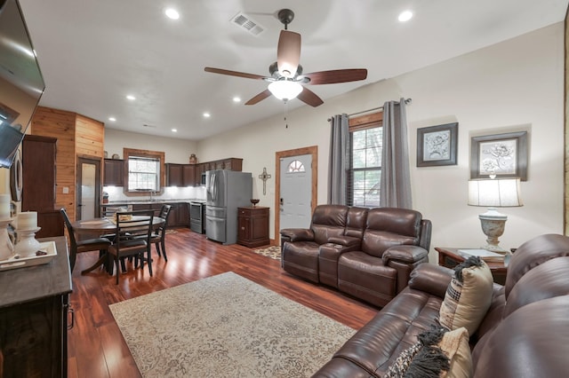 living area with visible vents, a ceiling fan, dark wood-style flooring, and recessed lighting