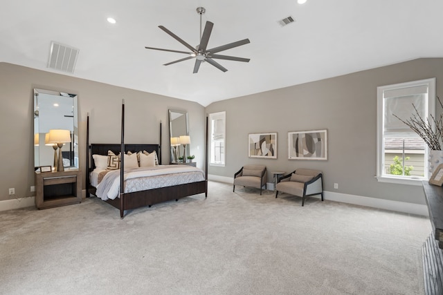 bedroom with carpet flooring, visible vents, and lofted ceiling