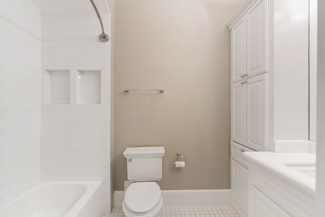 full bathroom with shower / bathing tub combination, tile patterned flooring, baseboards, vanity, and toilet