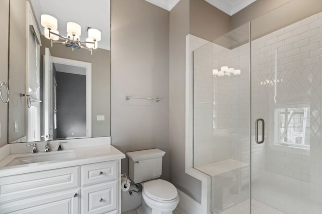 full bath with vanity, a stall shower, a chandelier, and toilet