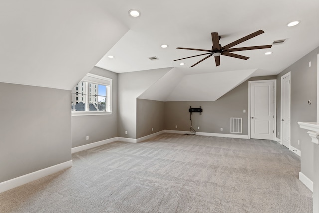 bonus room featuring ceiling fan, lofted ceiling, and visible vents