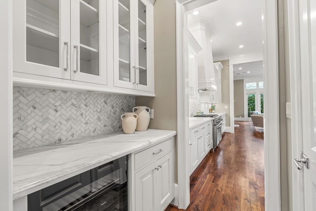 bar featuring decorative backsplash, high end stainless steel range, dark wood-style floors, wine cooler, and recessed lighting