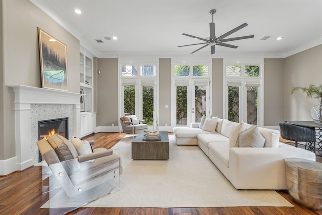 living room with ornamental molding, recessed lighting, ceiling fan, and wood finished floors