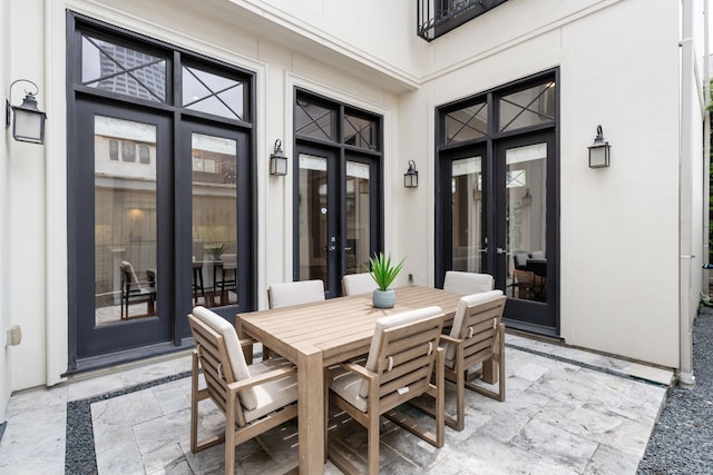 view of patio / terrace featuring french doors and outdoor dining space