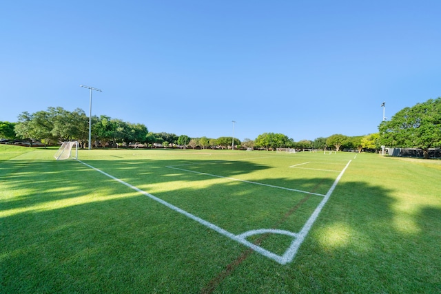 surrounding community featuring an area for soccer