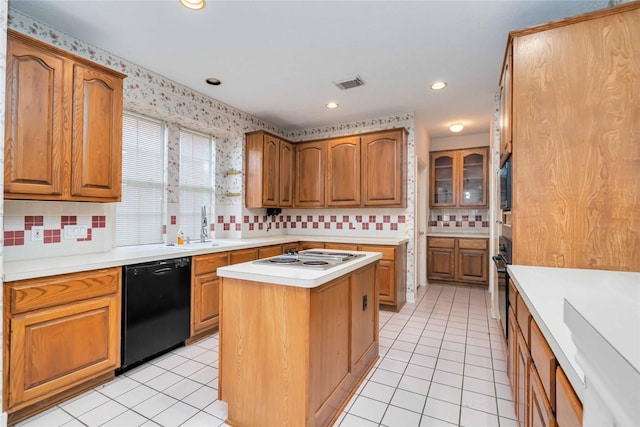 kitchen with black appliances, tasteful backsplash, light tile patterned floors, a kitchen island, and recessed lighting