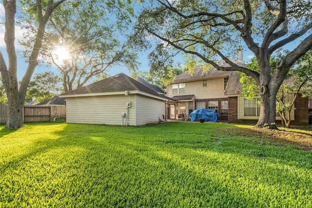 5818 Wilkins Ln, Sugar Land, TX 77479 - back of house featuring brick siding and a chimney