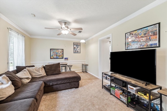 living area featuring crown molding, a ceiling fan, a textured ceiling, and light carpet