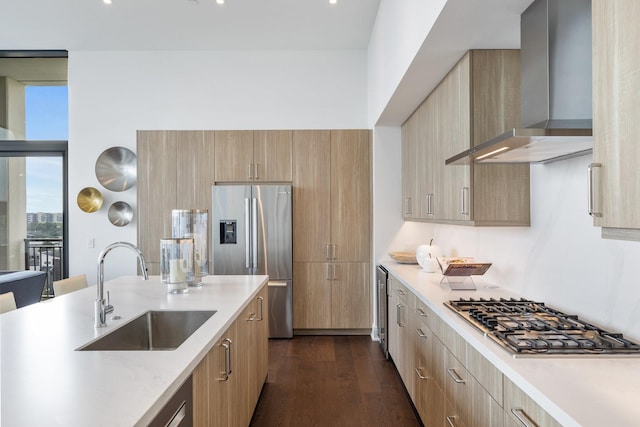 2323 W Main St Unit 703, Houston, TX 77098 - kitchen with stainless steel appliances, a sink, wall chimney exhaust hood, and modern cabinets