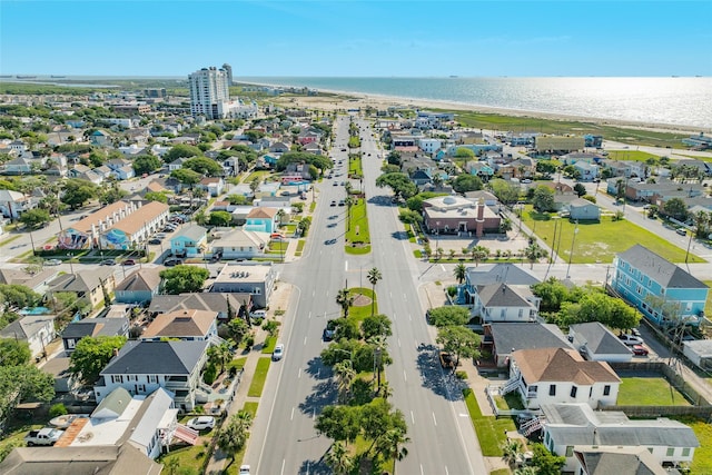 drone / aerial view with a water view and a residential view