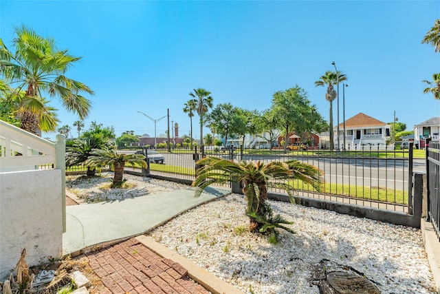 view of property's community featuring fence and a residential view