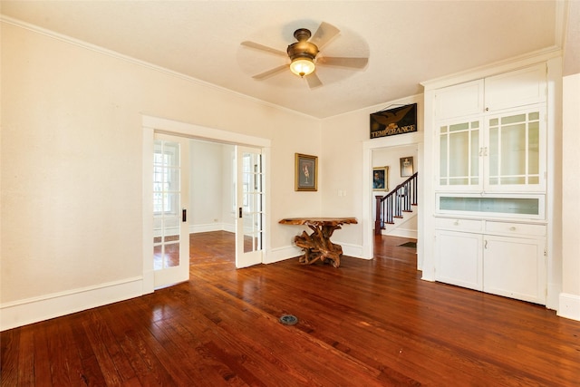 unfurnished room featuring crown molding, french doors, hardwood / wood-style floors, a ceiling fan, and baseboards