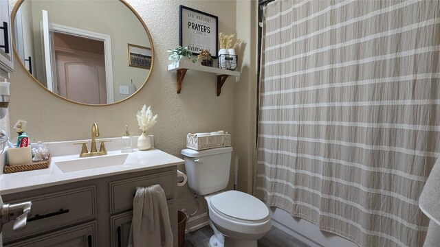 12813 Narrow Cove Dr, Texas City, TX 77568 - full bath with vanity, toilet, curtained shower, and a textured wall