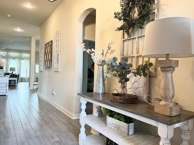 12813 Narrow Cove Dr, Texas City, TX 77568 - corridor featuring baseboards, recessed lighting, wood finished floors, and arched walkways
