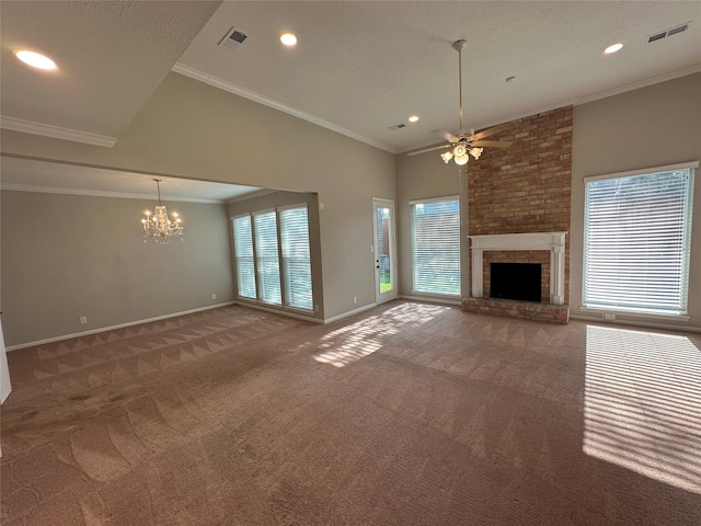 unfurnished living room featuring visible vents, carpet floors, ceiling fan with notable chandelier, and a wealth of natural light