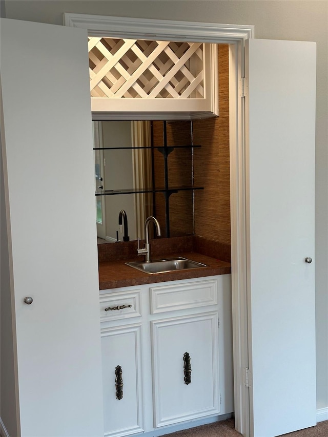 bar featuring a sink and wet bar