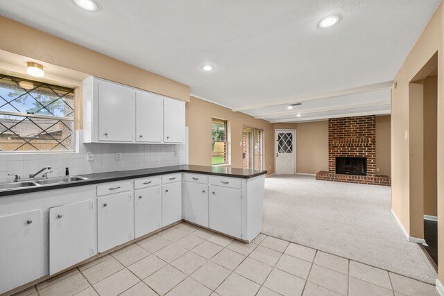2022 Willow Wisp Ln, Spring, TX 77388 - kitchen featuring recessed lighting, dark countertops, light carpet, and a sink