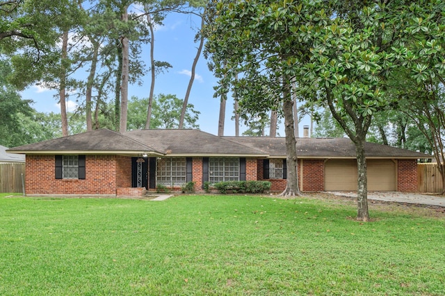 2022 Willow Wisp Ln, Spring, TX 77388 - ranch-style house featuring brick siding, fence, a front yard, and a garage