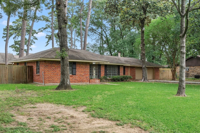 2022 Willow Wisp Ln, Spring, TX 77388 - ranch-style home with fence, a front lawn, and a garage