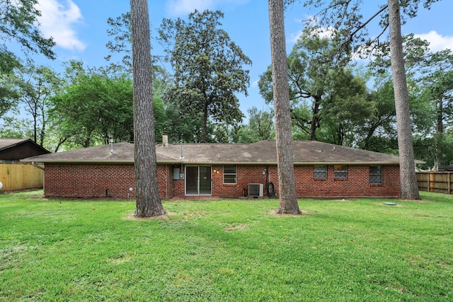 2022 Willow Wisp Ln, Spring, TX 77388 - back of property featuring fence, central AC unit, a yard, and brick siding