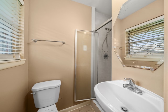 2022 Willow Wisp Ln, Spring, TX 77388 - full bathroom featuring toilet, a sink, tile patterned flooring, and a stall shower