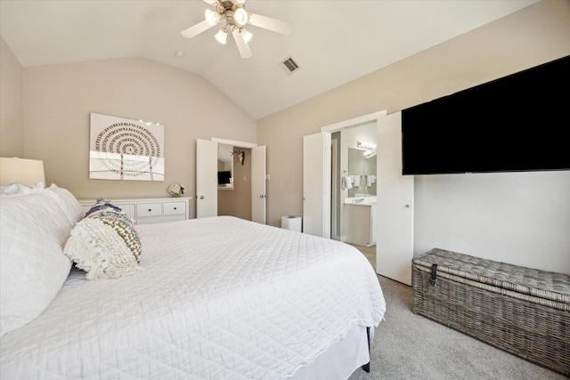 bedroom with connected bathroom, ceiling fan, light carpet, lofted ceiling, and visible vents
