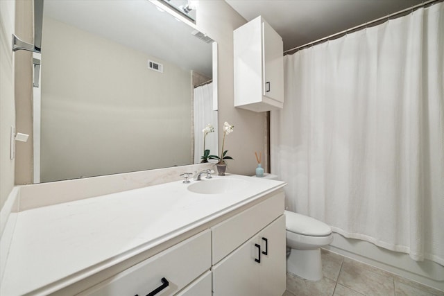 bathroom featuring visible vents, vanity, toilet, tile patterned floors, and shower / tub combo