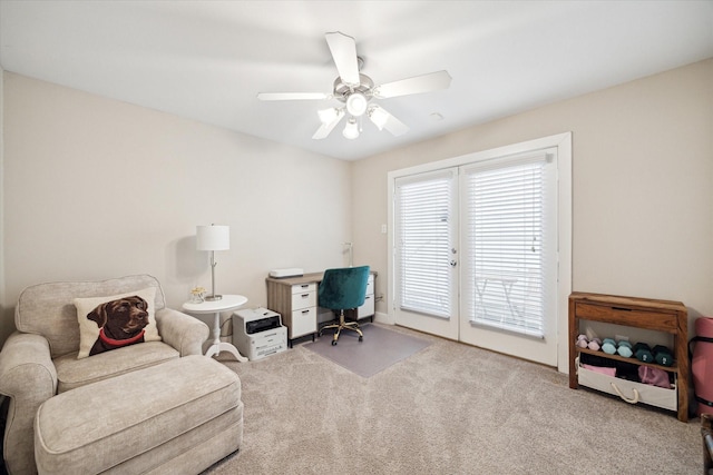 carpeted office space with ceiling fan