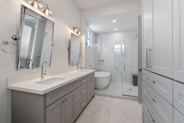 bathroom featuring recessed lighting, a sink, marble finish floor, and a marble finish shower