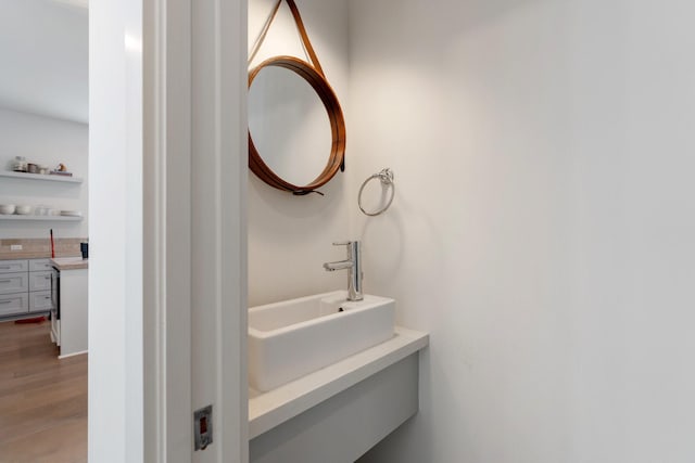 bathroom featuring a sink and wood finished floors